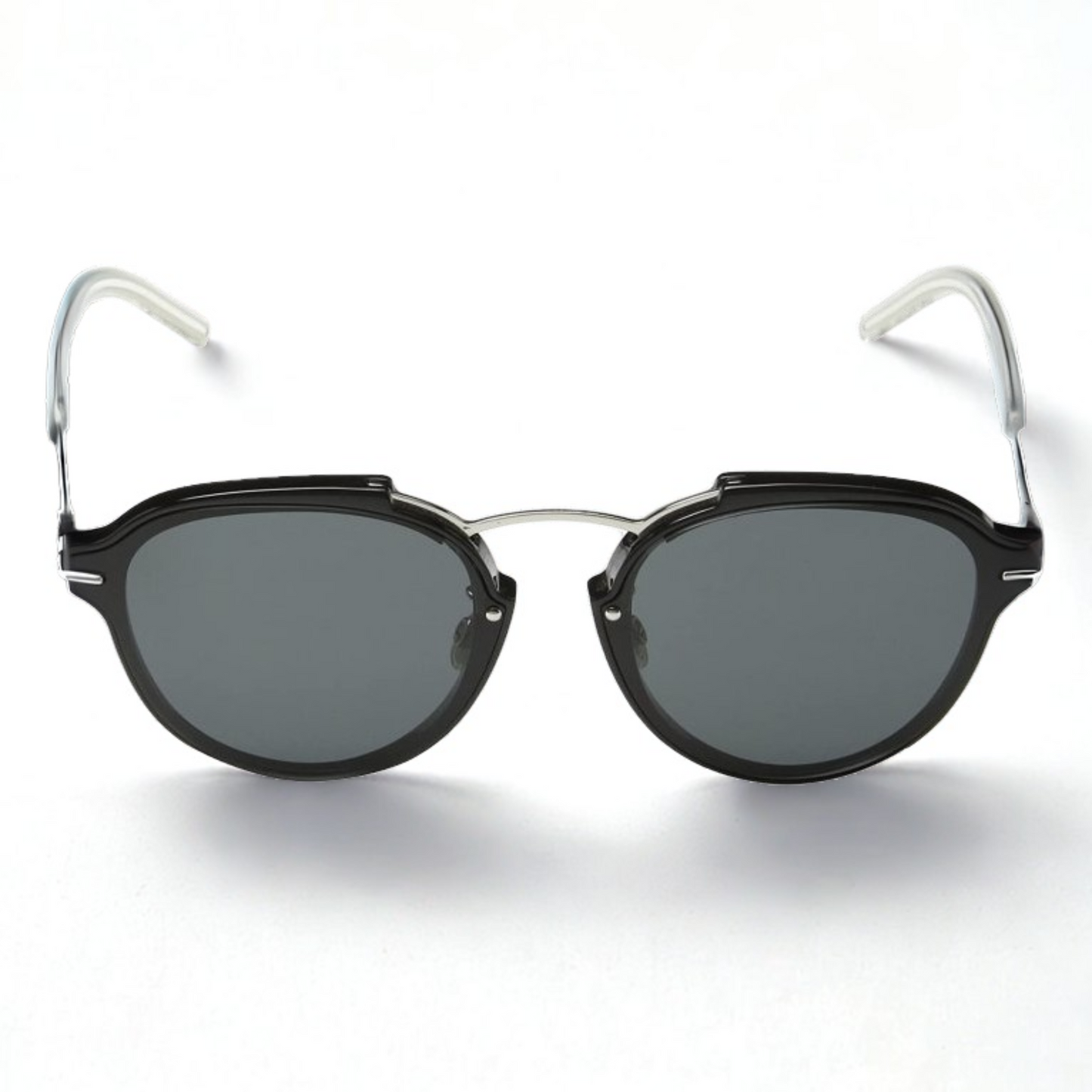 Gafas Dior Dioreclat RMG/P9 de frente con montura negra y varillas transparentes, diseño redondeado unisex, disponibles en Óptica Palmanova, Calvià