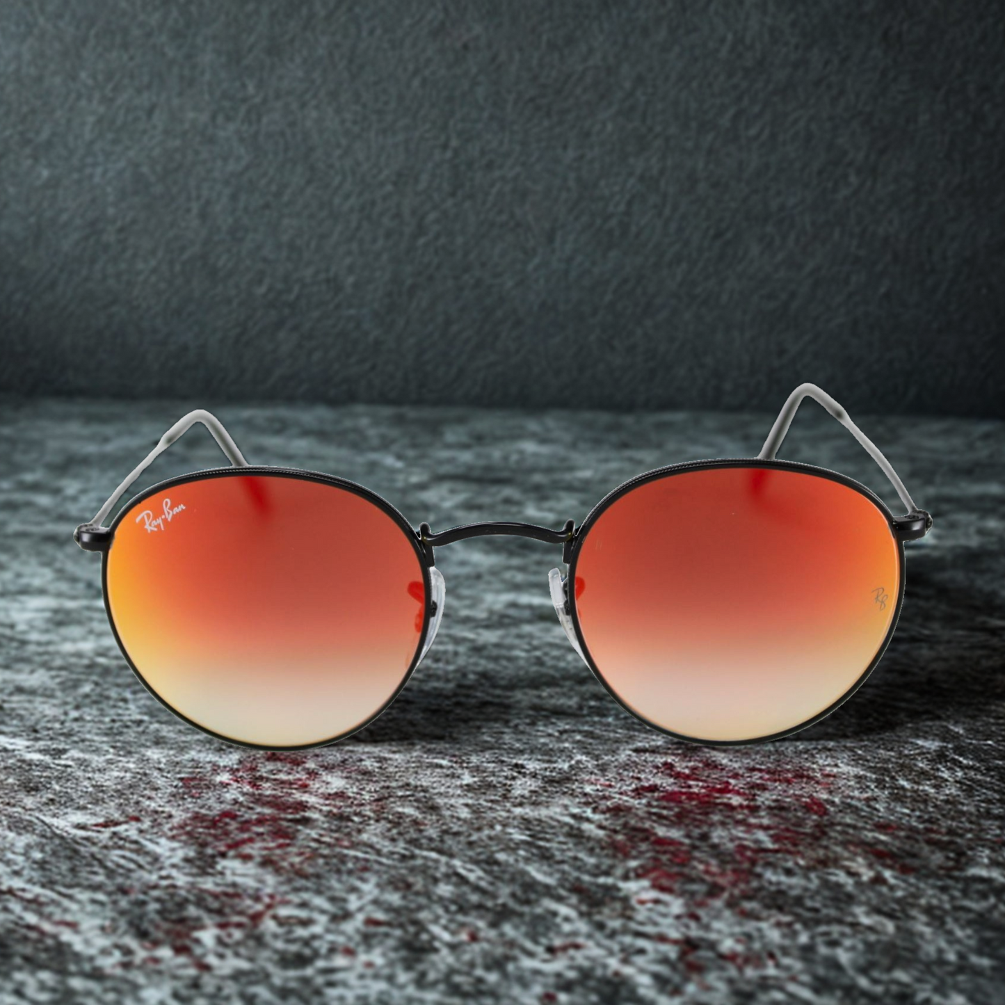Ray-Ban RB3447 Round Metal con montura metálica redonda color plata y lentes espejo rojo categoría 3 UV400 en Óptica Palmanova, Calvià
