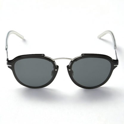 Gafas Dior Dioreclat RMG/P9 de frente con montura negra y varillas transparentes, diseño redondeado unisex, disponibles en Óptica Palmanova, Calvià