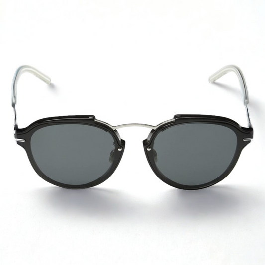 Gafas Dior Dioreclat RMG/P9 de frente con montura negra y varillas transparentes, diseño redondeado unisex, disponibles en Óptica Palmanova, Calvià