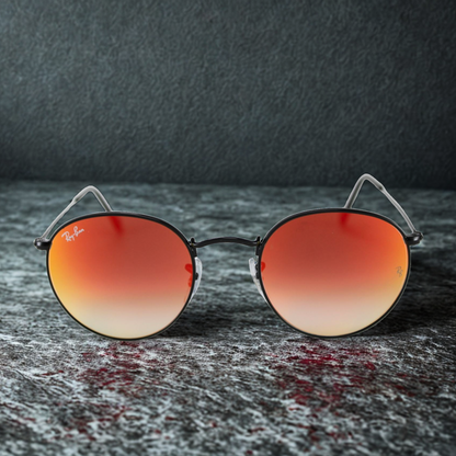 Ray-Ban RB3447 Round Metal con montura metálica redonda color plata y lentes espejo rojo categoría 3 UV400 en Óptica Palmanova, Calvià