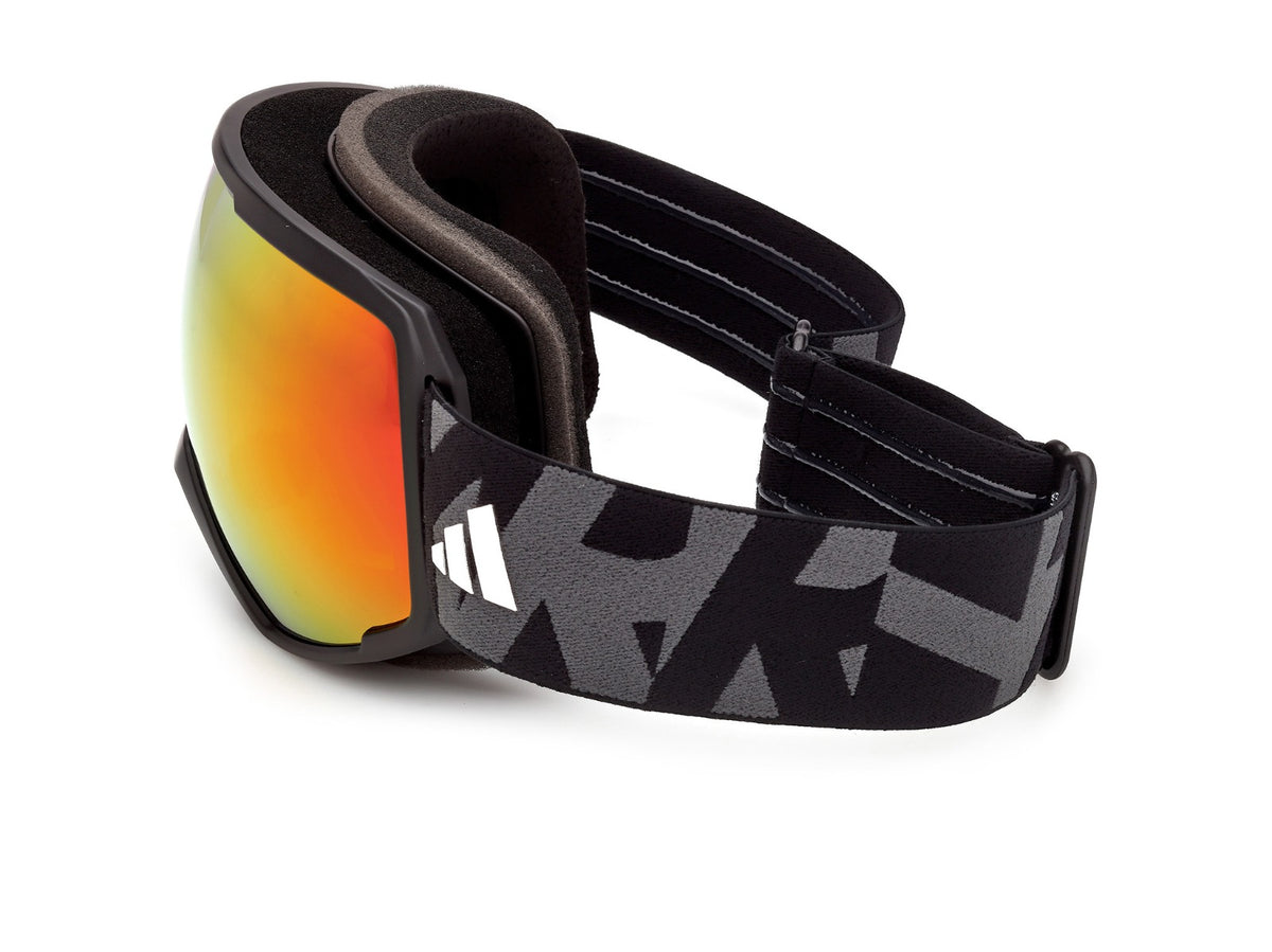adidas SP0121 02U de côté : mousse intérieure noire et grise, écran miroir orange et sangle noire avec imprimé graphique gris